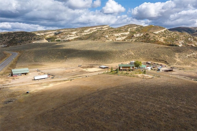 exterior space with a rural view and a mountain view