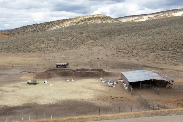 mountain view featuring a rural view
