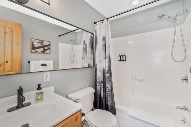 full bath with shower / bath combination with curtain, toilet, and vanity