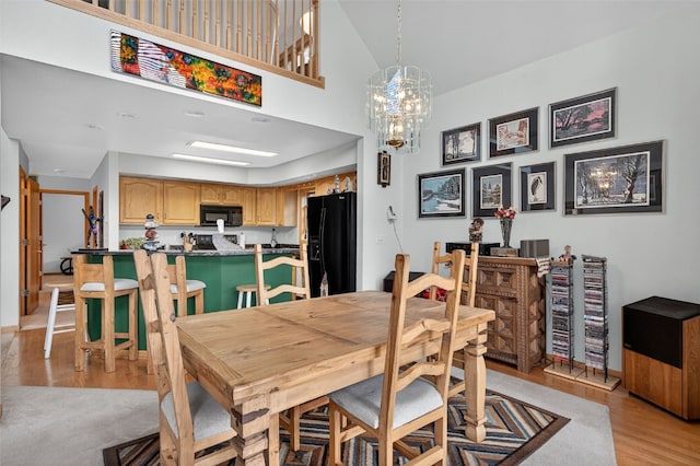 441 Kimmes Ln, Breckenridge, CO 80424 - dining room with light wood finished floors and a chandelier