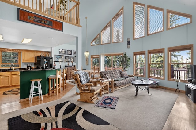 441 Kimmes Ln, Breckenridge, CO 80424 - living room featuring a towering ceiling and light wood finished floors