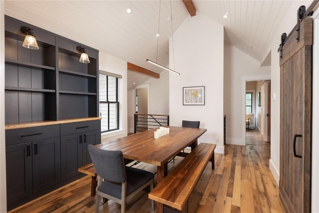 300 E Washington Ave, Breckenridge, CO 80424 - dining space with a barn door, wood-type flooring, beamed ceiling, and high vaulted ceiling