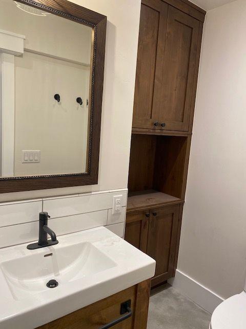 300 E Washington Ave, Breckenridge, CO 80424 - half bathroom featuring vanity and toilet
