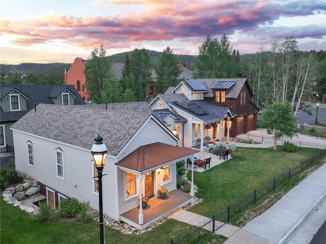 300 E Washington Ave, Breckenridge, CO 80424 - view of front of house with a fenced backyard, roof with shingles, a garage, and driveway