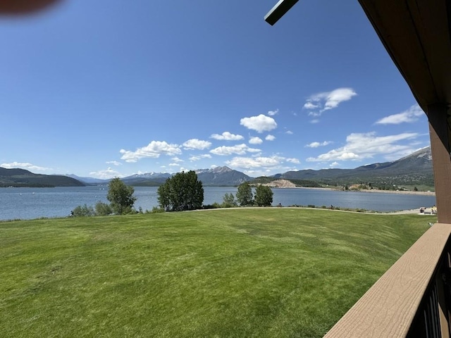 401 W La Bonte St Unit 210, Dillon, CO 80435 - view of grassy yard featuring a water and mountain view