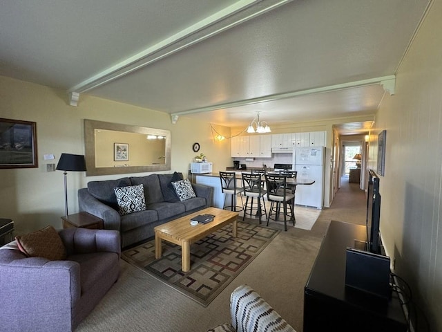 401 W La Bonte St Unit 210, Dillon, CO 80435 - living room with a chandelier, beamed ceiling, and light carpet