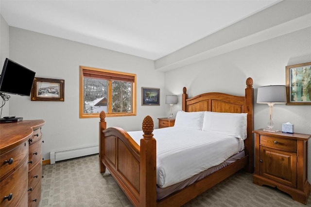 23110 US Highway 6 Unit 5044, Keystone, CO 80435 - bedroom featuring baseboard heating, light carpet, and baseboards