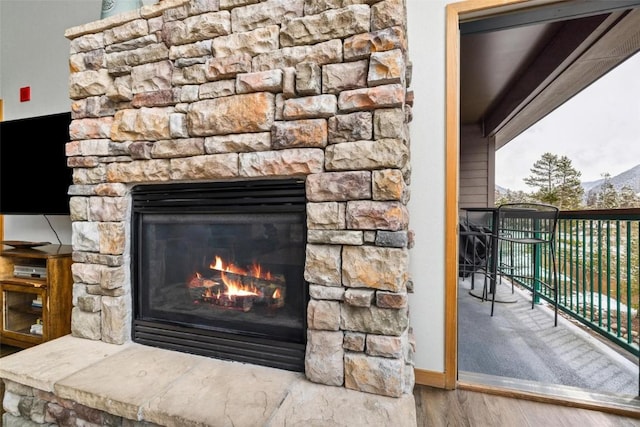 23110 US Highway 6 Unit 5044, Keystone, CO 80435 - detailed view of wood finished floors, a fireplace, and a mountain view
