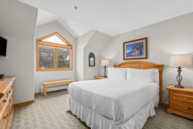 23110 US Highway 6 Unit 5044, Keystone, CO 80435 - bedroom featuring light colored carpet, a baseboard radiator, baseboards, and lofted ceiling
