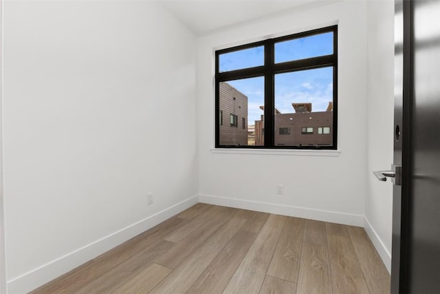 unfurnished room featuring light hardwood / wood-style flooring