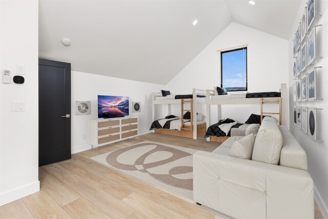 additional living space with lofted ceiling and light wood-type flooring