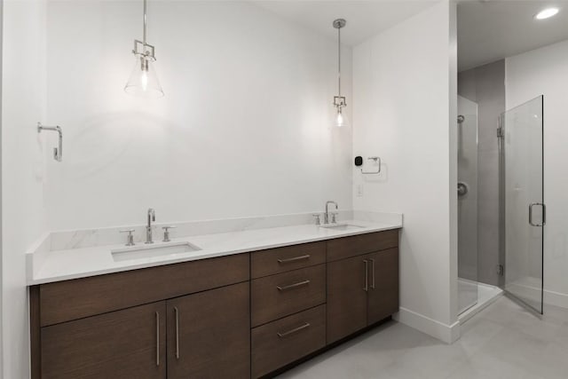 bathroom with tile patterned floors, vanity, and a shower with shower door