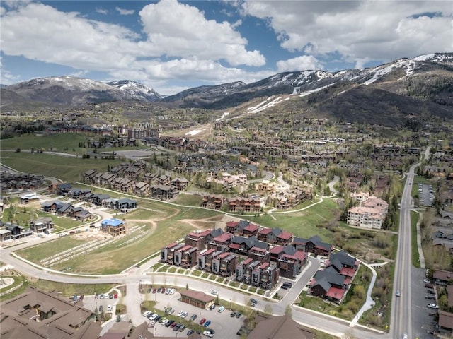 birds eye view of property with a mountain view