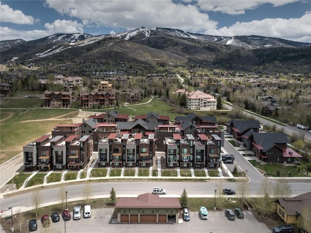 drone / aerial view featuring a mountain view