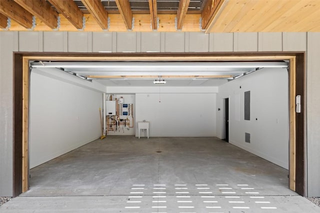 garage with electric panel and water heater