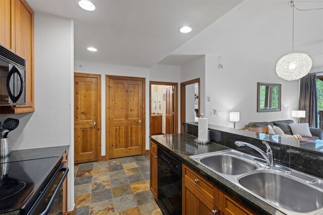 34 Highfield Trl Unit 203, Breckenridge, CO 80424 - kitchen featuring a sink, dark countertops, stone finish floor, brown cabinets, and black appliances