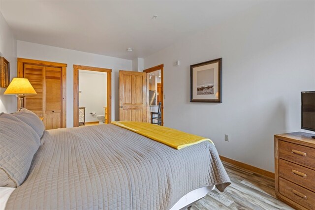 150 Dercum Sq Unit 8499, Keystone, CO 80435 - bedroom featuring light wood finished floors, baseboards, and a closet