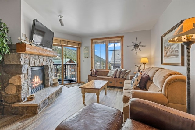 150 Dercum Sq Unit 8499, Keystone, CO 80435 - living room featuring a fireplace and hardwood / wood-style floors