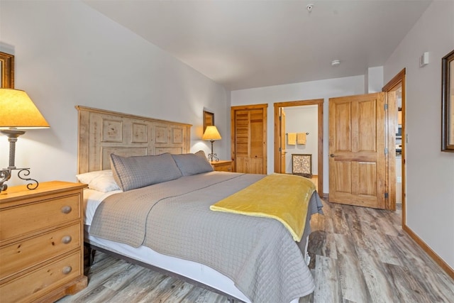 150 Dercum Sq Unit 8499, Keystone, CO 80435 - bedroom with light wood finished floors and baseboards