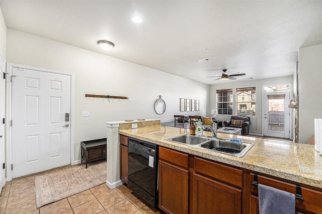 kitchen with brown cabinets, dishwasher, a ceiling fan, light tile patterned floors, and a sink