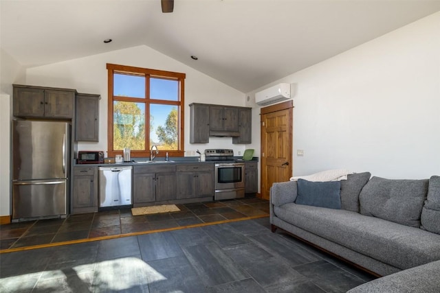 32505 County Road 20, Steamboat Springs, CO 80487 - kitchen featuring stainless steel appliances, a wall mounted AC, dark brown cabinetry, dark countertops, and open floor plan