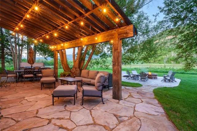 32505 County Road 20, Steamboat Springs, CO 80487 - view of patio with outdoor dining area and an outdoor living space with a fire pit