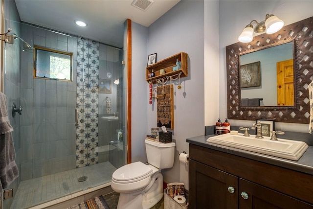 32505 County Road 20, Steamboat Springs, CO 80487 - bathroom featuring toilet, a stall shower, vanity, and recessed lighting