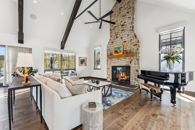 257 Barton Ridge Dr, Breckenridge, CO 80424 - living room with high vaulted ceiling, a stone fireplace, wood finished floors, and beamed ceiling