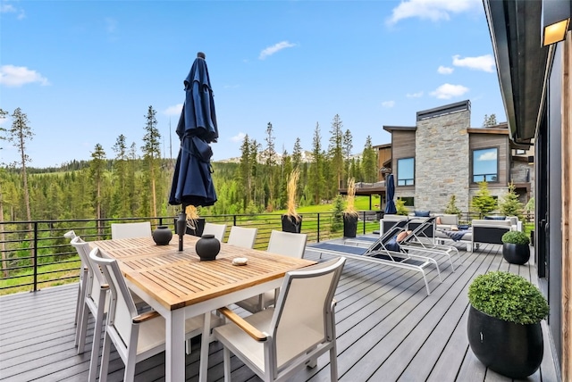 257 Barton Ridge Dr, Breckenridge, CO 80424 - wooden terrace featuring a wooded view and outdoor dining space