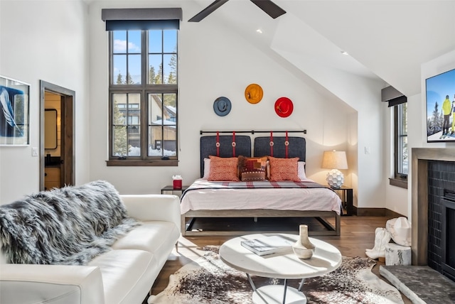 257 Barton Ridge Dr, Breckenridge, CO 80424 - bedroom featuring wood finished floors, multiple windows, high vaulted ceiling, and ceiling fan