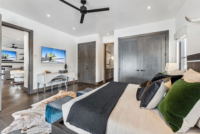 257 Barton Ridge Dr, Breckenridge, CO 80424 - bedroom featuring two closets, finished concrete flooring, recessed lighting, and a ceiling fan