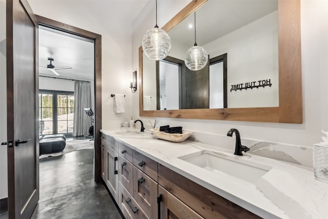257 Barton Ridge Dr, Breckenridge, CO 80424 - bathroom with double vanity, concrete floors, and a ceiling fan