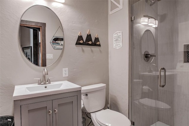 51 Salt Lick Cir Unit 51, Silverthorne, CO 80498 - bathroom with vanity, a shower stall, and a textured wall