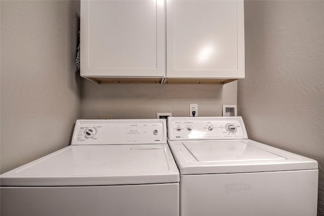 51 Salt Lick Cir Unit 51, Silverthorne, CO 80498 - washroom with cabinet space, independent washer and dryer, and a textured wall