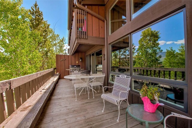 51 Salt Lick Cir Unit 51, Silverthorne, CO 80498 - wooden deck with outdoor dining area and area for grilling