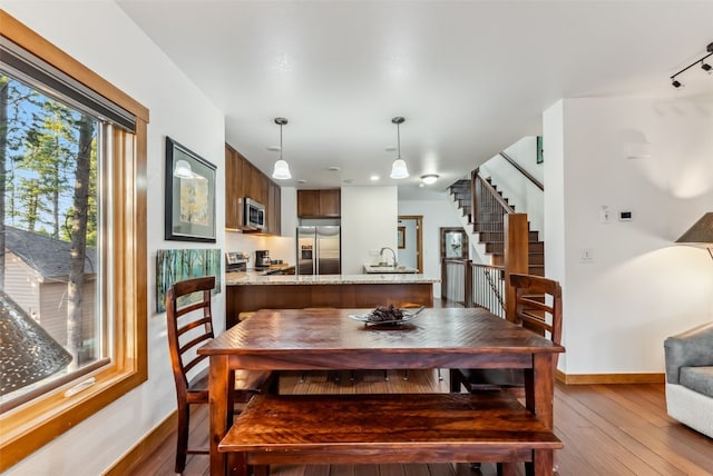 564 White Cloud Dr, Breckenridge, CO 80424 - dining space with stairs and hardwood / wood-style floors