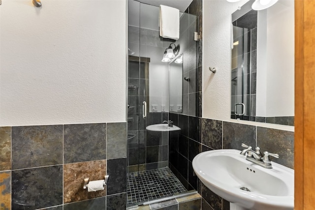 564 White Cloud Dr, Breckenridge, CO 80424 - bathroom with tile walls, a stall shower, and a textured wall