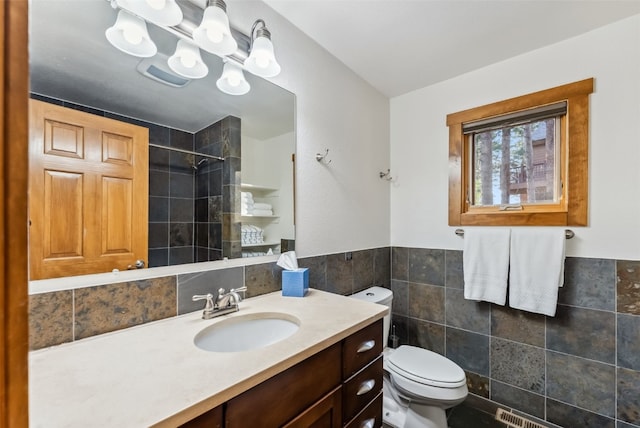 564 White Cloud Dr, Breckenridge, CO 80424 - full bathroom with tile walls, a tile shower, vanity, and wainscoting