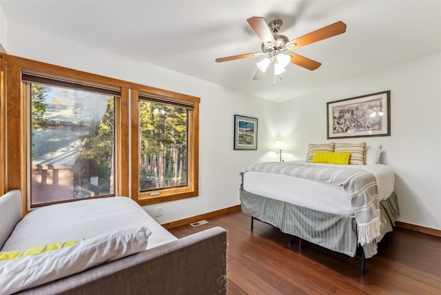 564 White Cloud Dr, Breckenridge, CO 80424 - bedroom with multiple windows, wood finished floors, and a ceiling fan