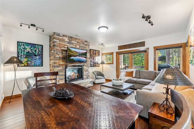 564 White Cloud Dr, Breckenridge, CO 80424 - living room with track lighting, hardwood / wood-style flooring, and a fireplace