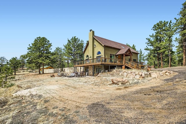 133 Lake Dr, Florissant, CO 80816 - rear view of property featuring a chimney and a deck