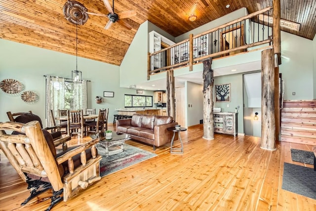 133 Lake Dr, Florissant, CO 80816 - living room featuring stairs, ceiling fan, wood ceiling, hardwood / wood-style flooring, and high vaulted ceiling