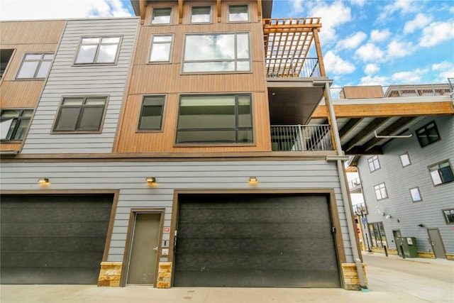 75 W 4th St Unit 204W, Silverthorne, CO 80498 - rear view of house with a garage and a balcony