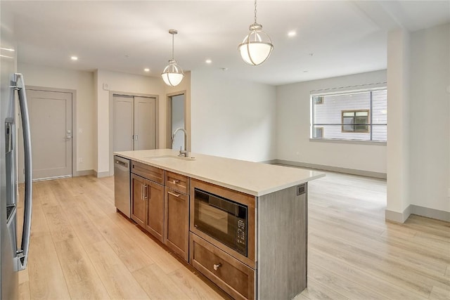 75 W 4th St Unit 204W, Silverthorne, CO 80498 - kitchen with recessed lighting, appliances with stainless steel finishes, a sink, and light wood-style flooring