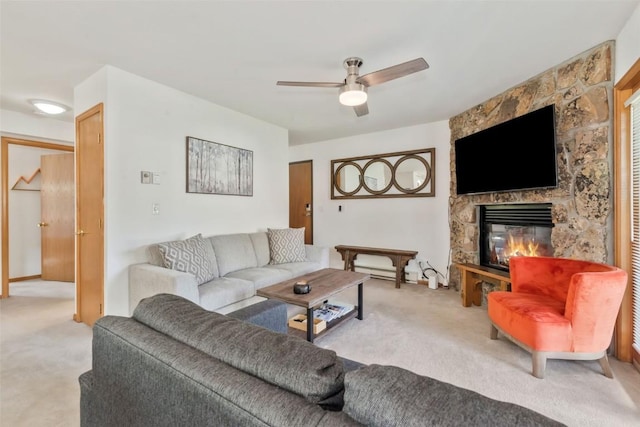 480 Ore House Plz Unit 106, Steamboat Springs, CO 80487 - living area featuring carpet floors, a fireplace, and ceiling fan