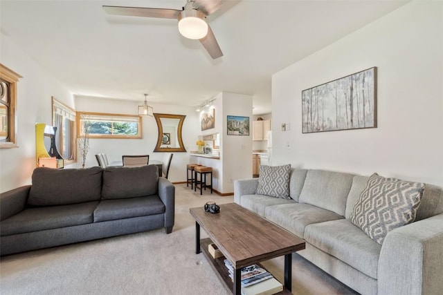 480 Ore House Plz Unit 106, Steamboat Springs, CO 80487 - living room featuring light colored carpet and ceiling fan