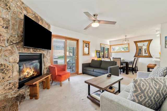 480 Ore House Plz Unit 106, Steamboat Springs, CO 80487 - living room with light carpet, a fireplace, and ceiling fan