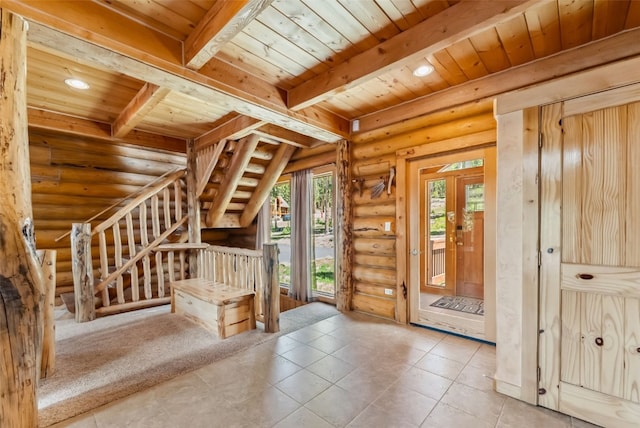 665 Whispering Pines Ln, Breckenridge, CO 80424 - foyer entrance with rustic walls, a wooden ceiling with exposed beams, recessed lighting, and tile patterned flooring
