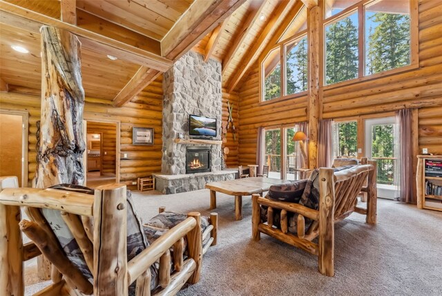 665 Whispering Pines Ln, Breckenridge, CO 80424 - living area featuring a wooden ceiling with exposed beams, a fireplace, high vaulted ceiling, carpet flooring, and log walls