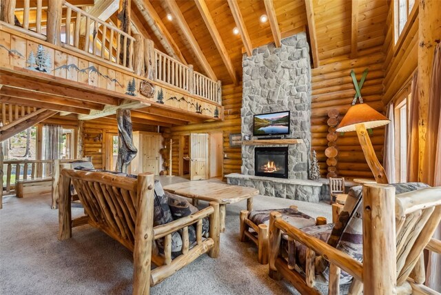 665 Whispering Pines Ln, Breckenridge, CO 80424 - carpeted living area with a wooden ceiling with exposed beams, high vaulted ceiling, a fireplace, and log walls